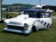 Purple and White 1955 Chevrolet Drag Car with checkered paint